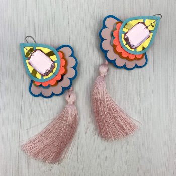 A pair of decorative teardrop shaped statement tassel earrings in pale pink, blue, gold and orange